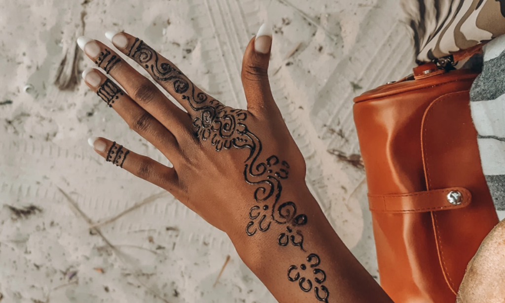 henna art painting on hand at Nyali beach in mombasa